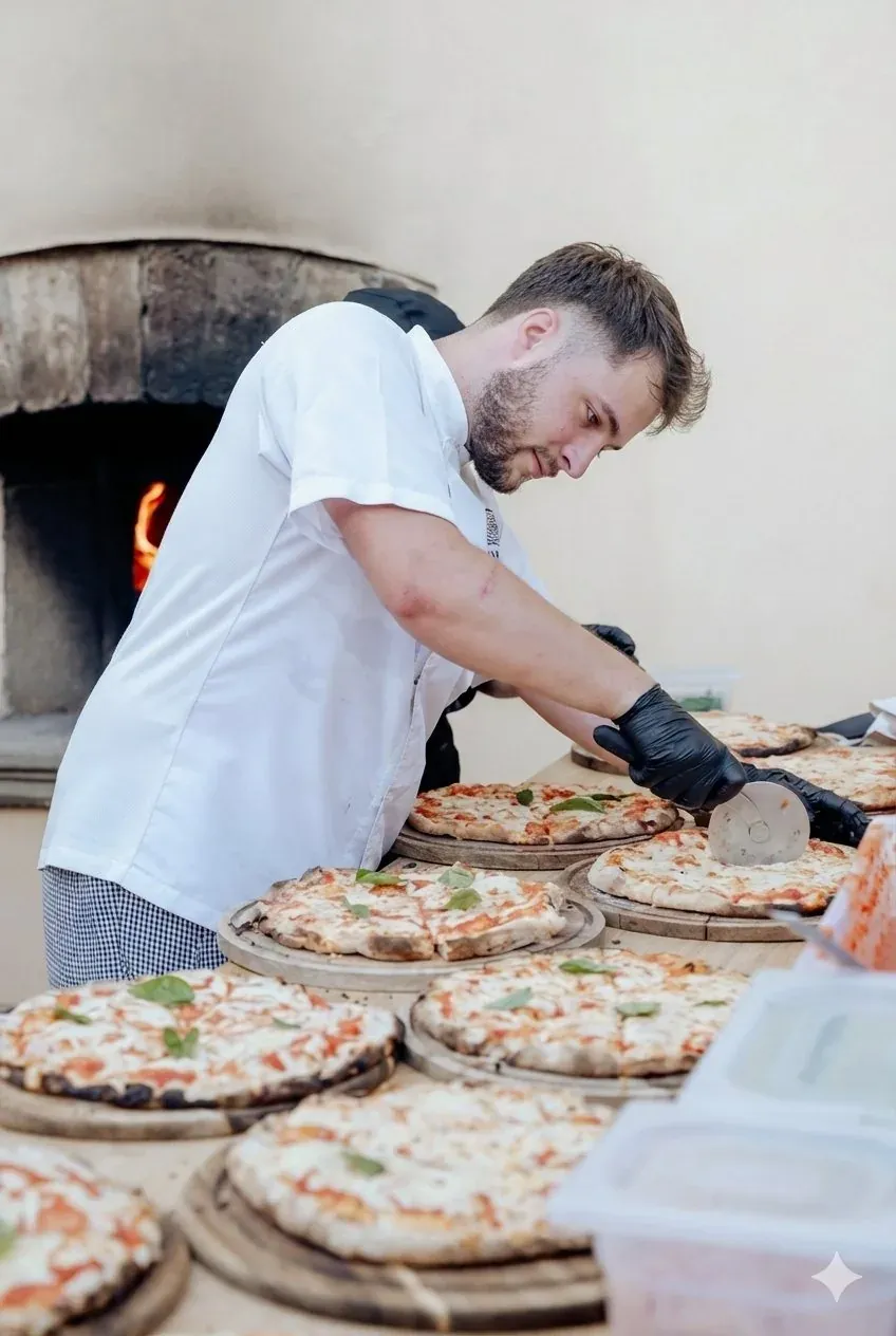 Un bambino tira la sfoglia accanto a un adulto su un tavolo di cucina a Firenze