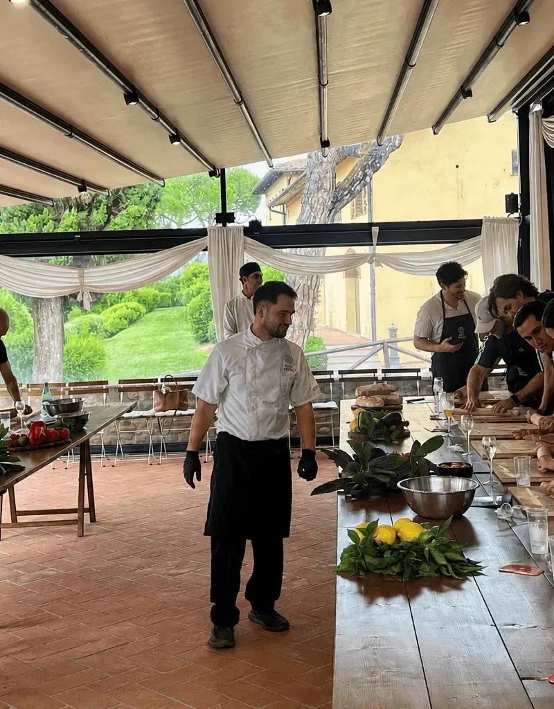 Guests rolling fresh pasta at The Chef’s Table class in our Florence kitchen